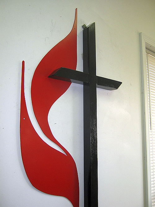 United Methodist church logo sign and lettering. United Methodist flame