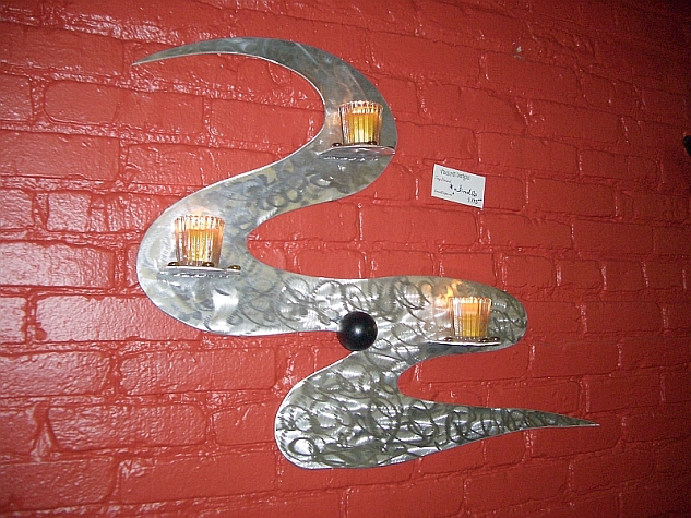 candle holder wall sculpture in brushed aluminum and metal