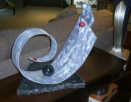 viscardi designs, tony viscardi, tabletop sculpture with a large granite base for tabletops. this tabletop sculpture is in modern abstract sculpture design. abstract tabletop sculpture for any room or decor