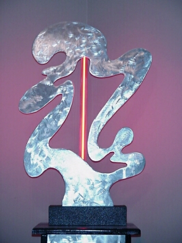 art stand in aluminum and black wood to hold tabletop sculptures. art stand or plant stand in metal and wood.